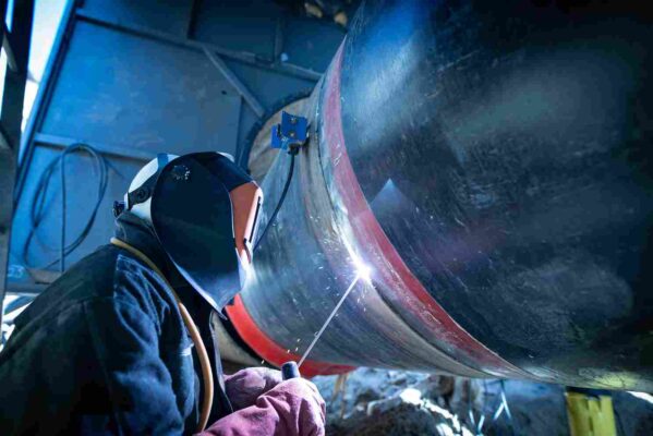 professional welder welding pipe pipeline construction